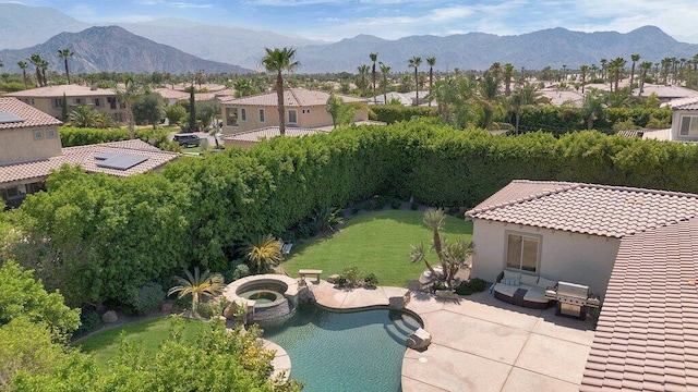 birds eye view of property with a mountain view