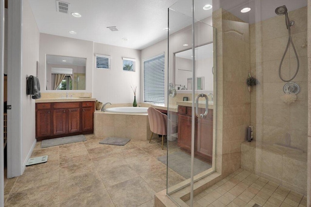 bathroom featuring separate shower and tub, tile patterned flooring, and vanity