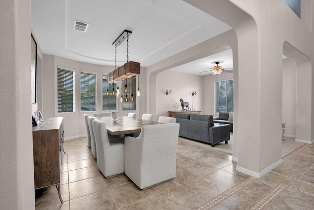 dining area featuring ceiling fan and light tile patterned floors