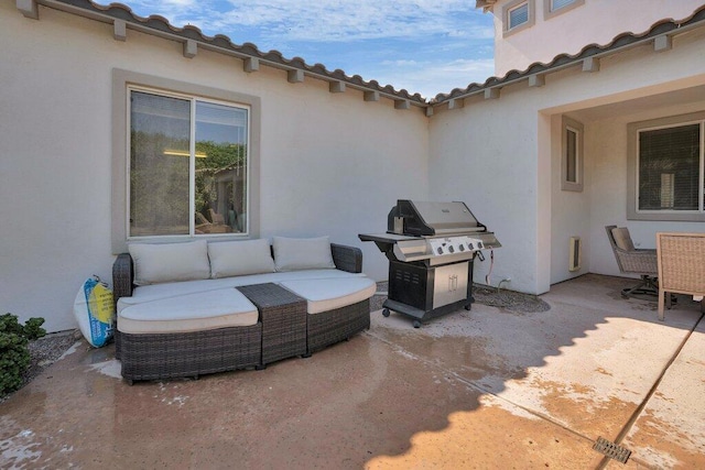 view of patio / terrace featuring an outdoor living space and grilling area