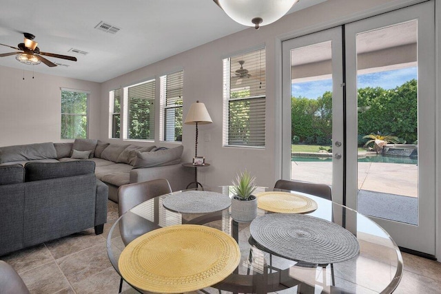 living room featuring ceiling fan and light tile patterned flooring