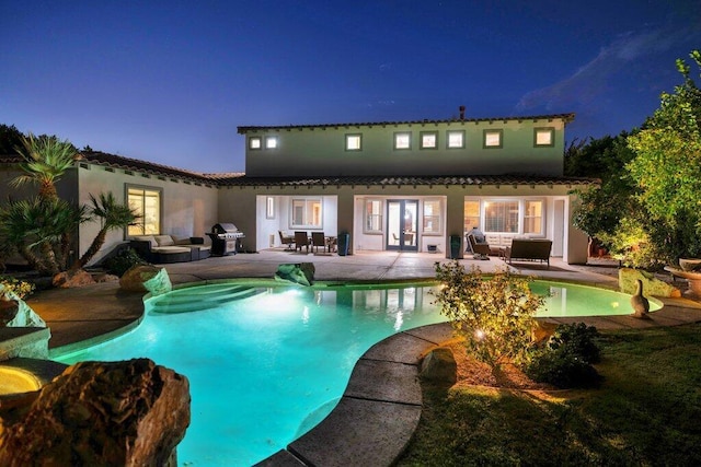 view of pool featuring french doors, an outdoor hangout area, a patio, and area for grilling