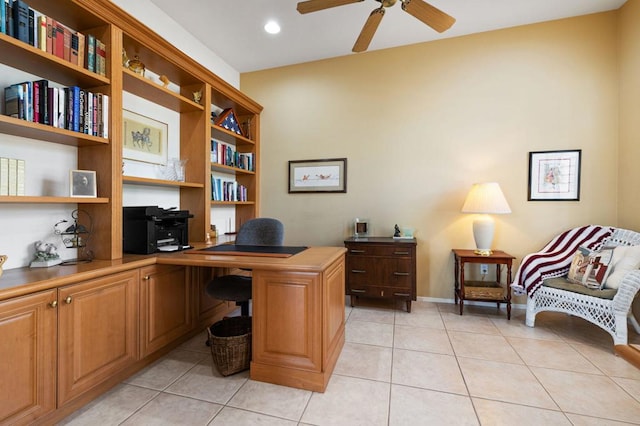 tiled office featuring built in desk and ceiling fan