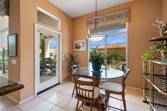 dining space featuring light tile patterned floors