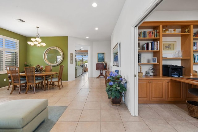 interior space featuring a chandelier and light tile patterned floors