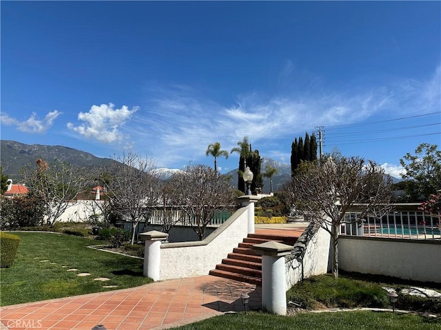 view of patio featuring a mountain view and a pool