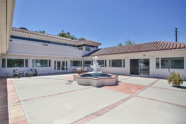 rear view of house with a patio area