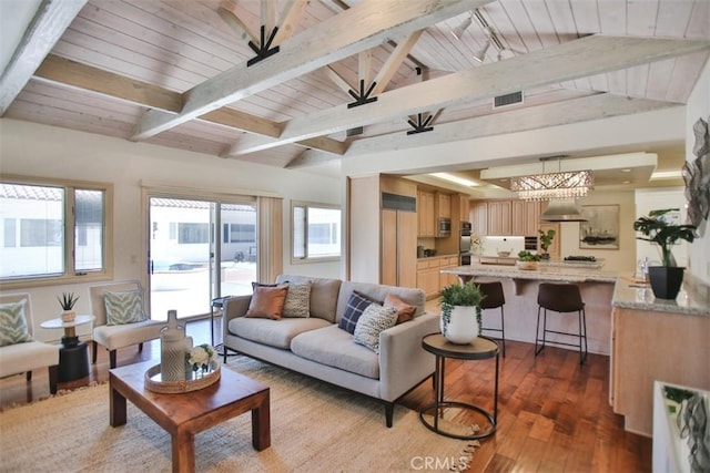 living room featuring lofted ceiling with beams, light wood-type flooring, and wooden ceiling