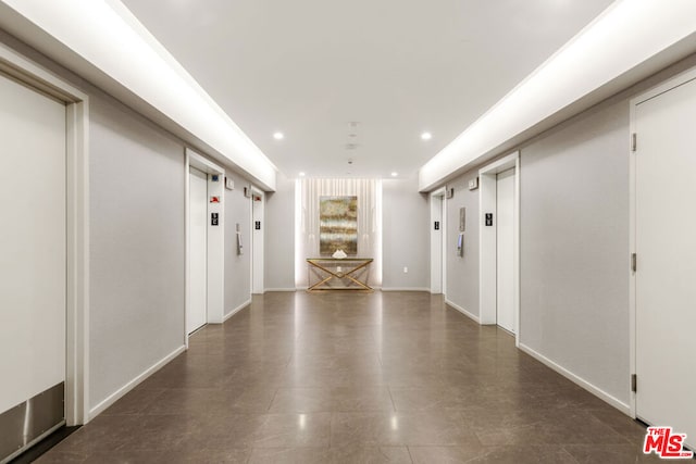 hallway featuring elevator