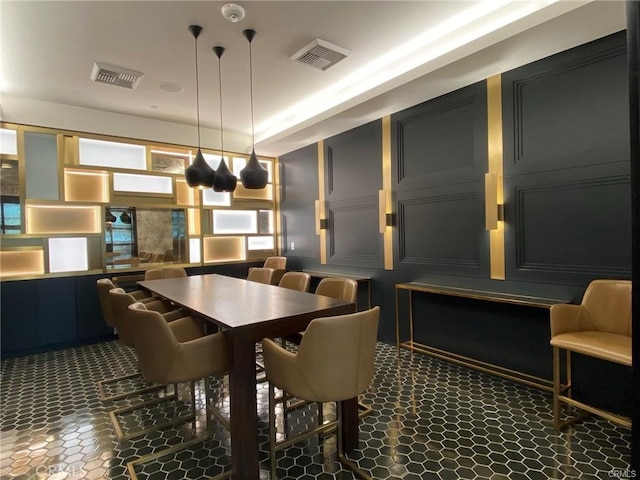 dining room with dark tile patterned floors