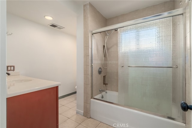 bathroom with vanity, enclosed tub / shower combo, and tile patterned floors