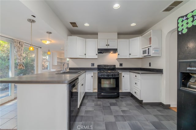 kitchen with white cabinets, black appliances, sink, and decorative light fixtures