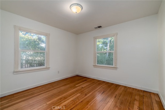 unfurnished room featuring light wood-type flooring