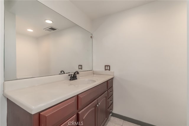 bathroom with vanity and tile patterned flooring