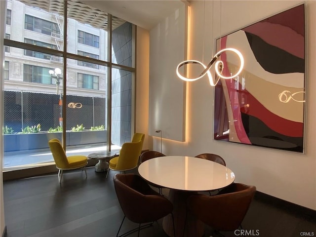 dining area with wood-type flooring