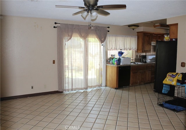 kitchen featuring black appliances, light tile patterned floors, and ceiling fan