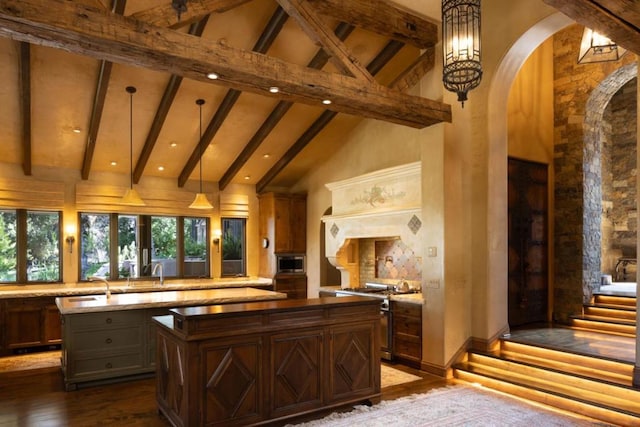 bar featuring high vaulted ceiling, hanging light fixtures, dark hardwood / wood-style floors, light stone countertops, and stainless steel appliances