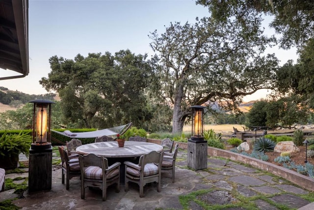 view of patio terrace at dusk