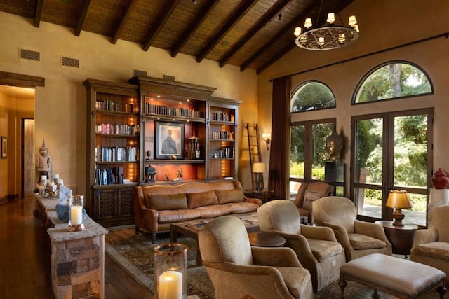 sitting room with dark wood-type flooring, high vaulted ceiling, beamed ceiling, a notable chandelier, and wood ceiling