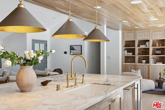 kitchen with light stone counters, sink, wooden ceiling, and lofted ceiling