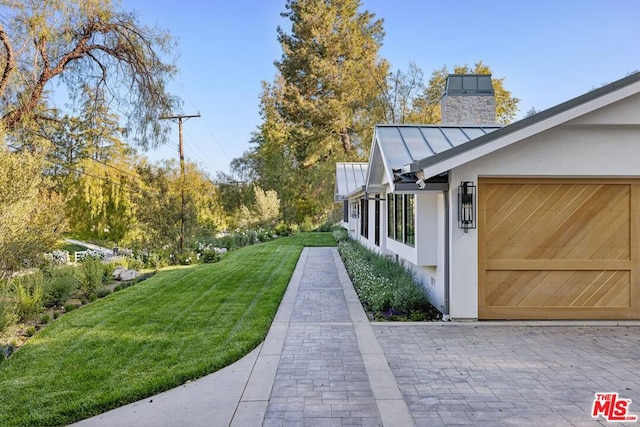 view of yard with a garage