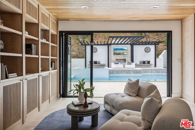 interior space featuring light hardwood / wood-style floors and wood ceiling