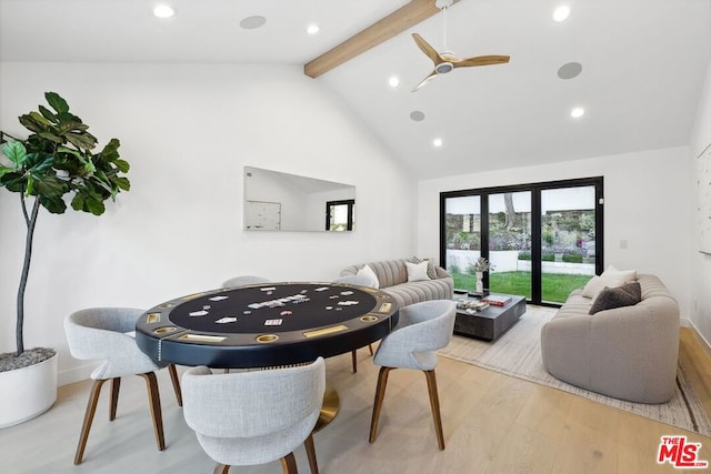 living room with beam ceiling, high vaulted ceiling, light hardwood / wood-style flooring, and ceiling fan