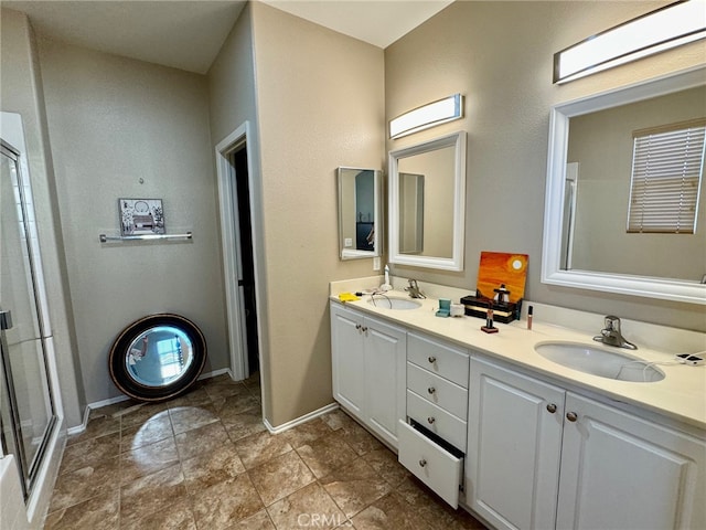 bathroom with walk in shower and vanity