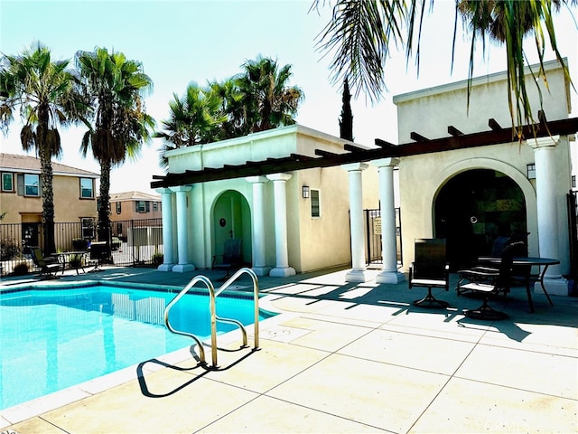 view of swimming pool with a patio