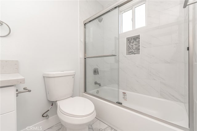 full bathroom featuring shower / bath combination with glass door, vanity, and toilet