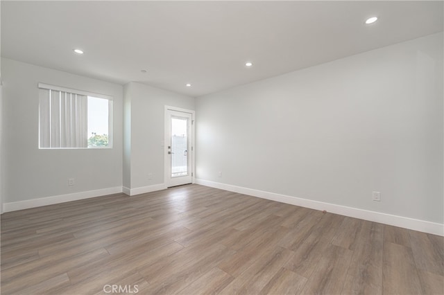 unfurnished room featuring light wood-type flooring