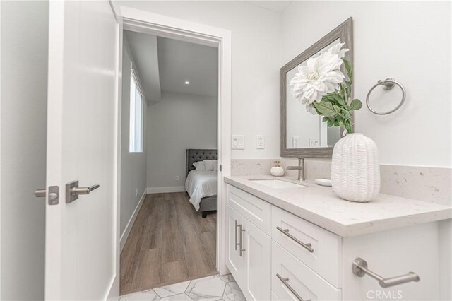 bathroom featuring vanity and hardwood / wood-style floors