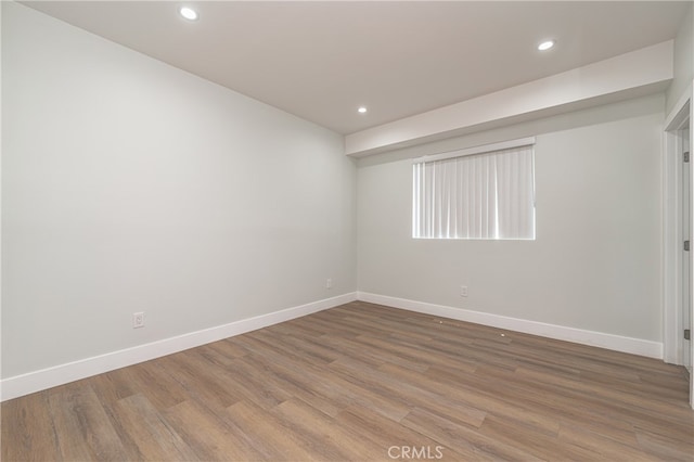 unfurnished room featuring wood-type flooring