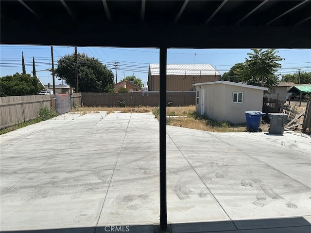 view of patio featuring an outbuilding