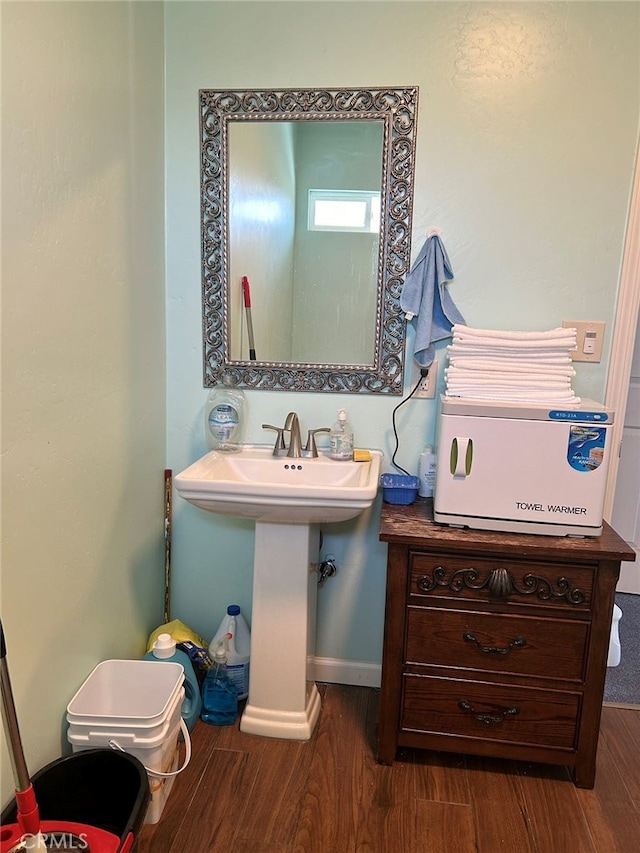 bathroom featuring sink and hardwood / wood-style flooring