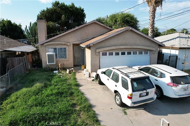 ranch-style home with a front lawn and a garage