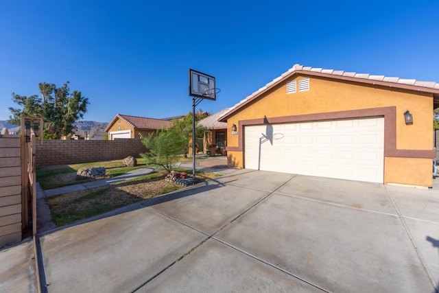 ranch-style house featuring a garage