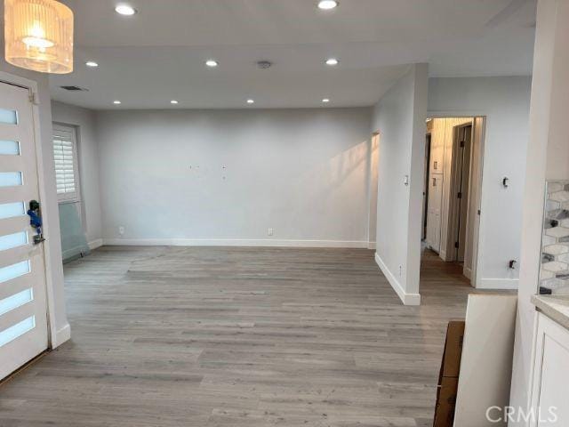 6053 Turnergrove Dr, Lakewood, CA 90713 - empty room featuring light wood finished floors, baseboards, and recessed lighting