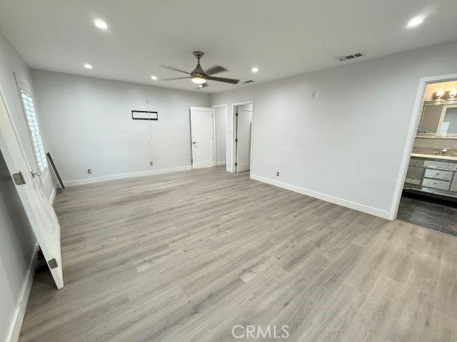 6053 Turnergrove Dr, Lakewood, CA 90713 - unfurnished bedroom featuring recessed lighting, baseboards, light wood-style flooring, a ceiling fan, and connected bathroom
