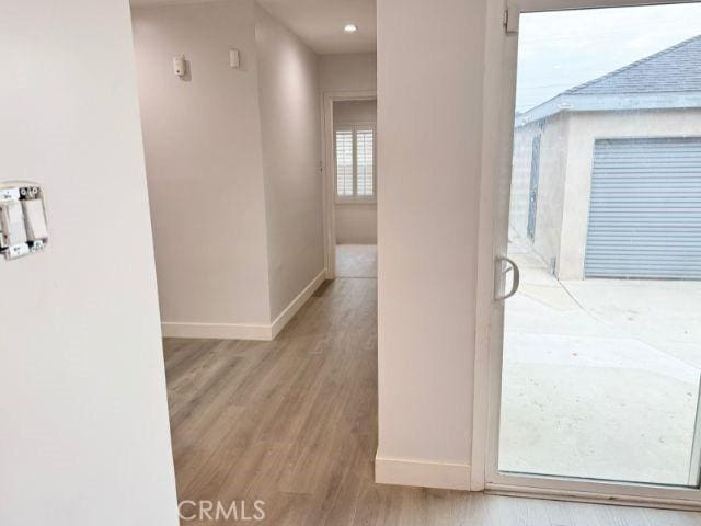 6053 Turnergrove Dr, Lakewood, CA 90713 - hall with baseboards and wood finished floors
