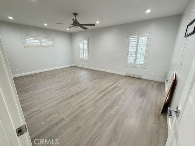 6053 Turnergrove Dr, Lakewood, CA 90713 - empty room featuring a ceiling fan, recessed lighting, baseboards, and light wood-type flooring