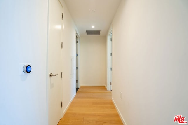 corridor featuring light wood-type flooring