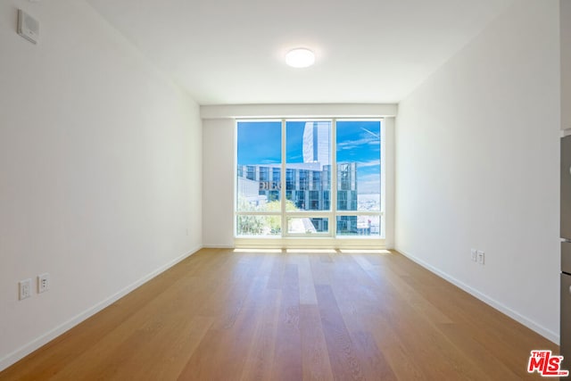 empty room featuring hardwood / wood-style flooring