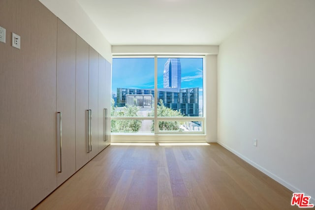 spare room featuring light hardwood / wood-style flooring