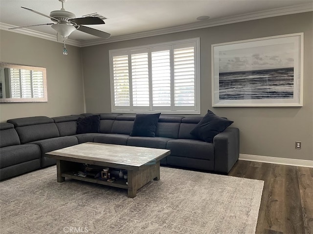 living room featuring ornamental molding, ceiling fan, and wood-type flooring