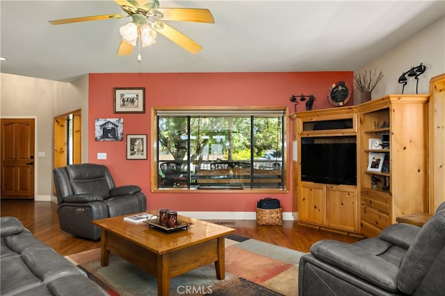 living room with hardwood / wood-style floors and ceiling fan