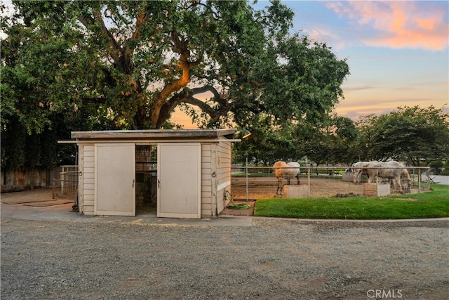 view of outdoor structure at dusk