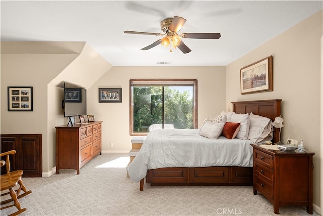 bedroom featuring light colored carpet and ceiling fan