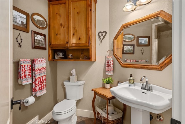 bathroom featuring sink and toilet