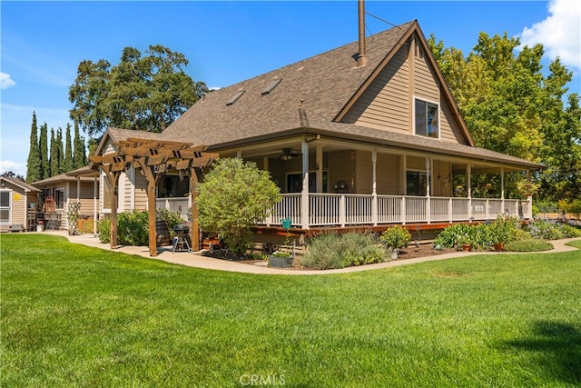 back of house with a pergola, ceiling fan, a lawn, and a porch